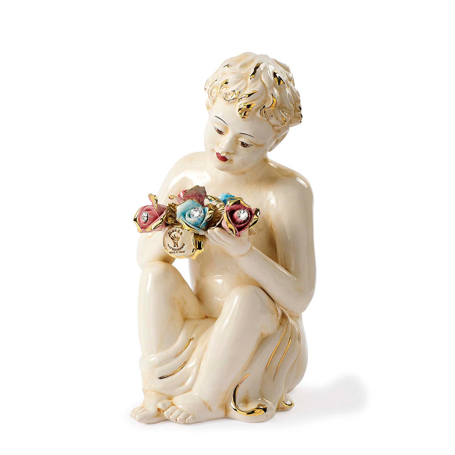Capodimonte putto with two-tone bouquet of roses